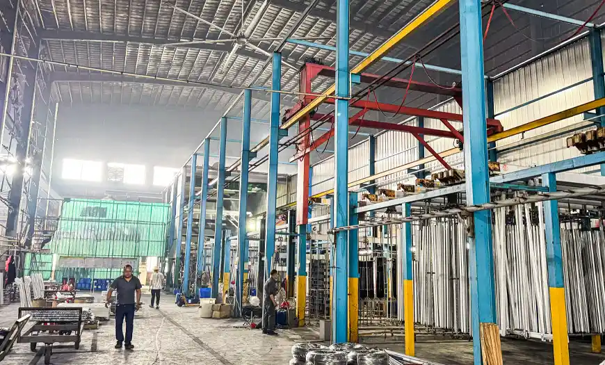 Aluminum profile anodizing and oxidation production line with vertically hanging extruded profiles in the factory