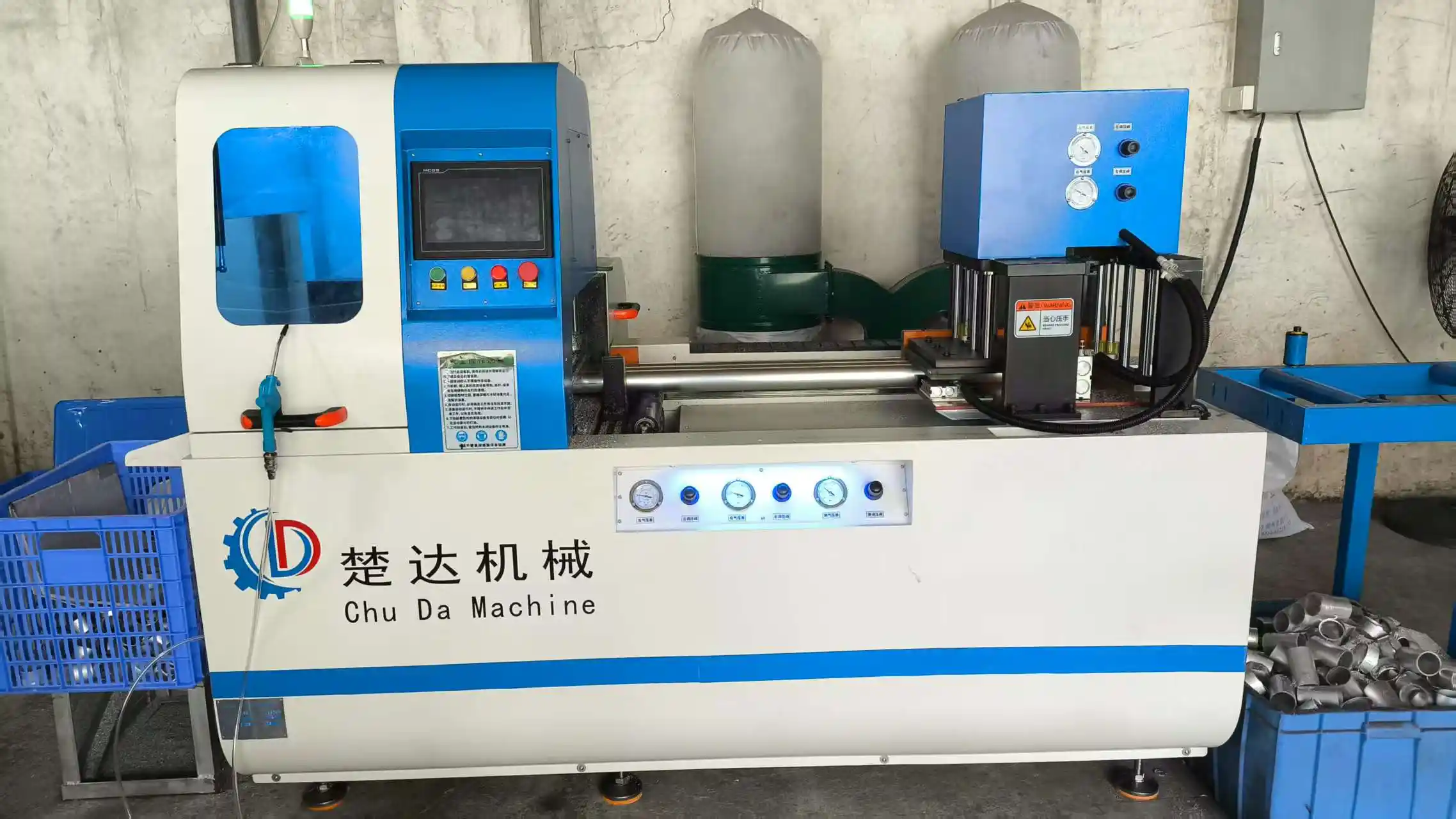Automatic precision aluminum tube cutting machine slicing metal pipes with an industrial dust collection system
