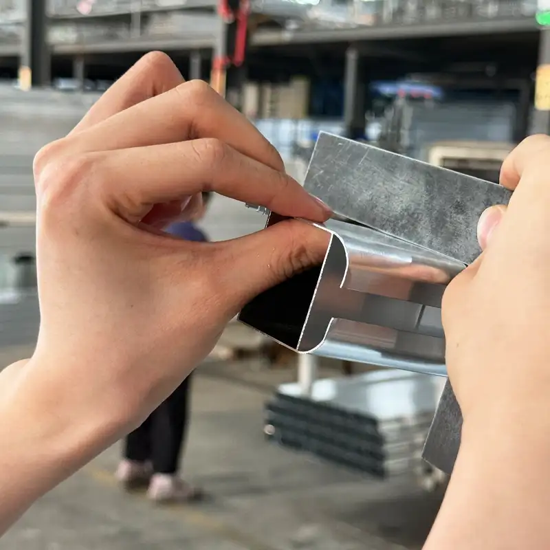 Inspector checking coating thickness
