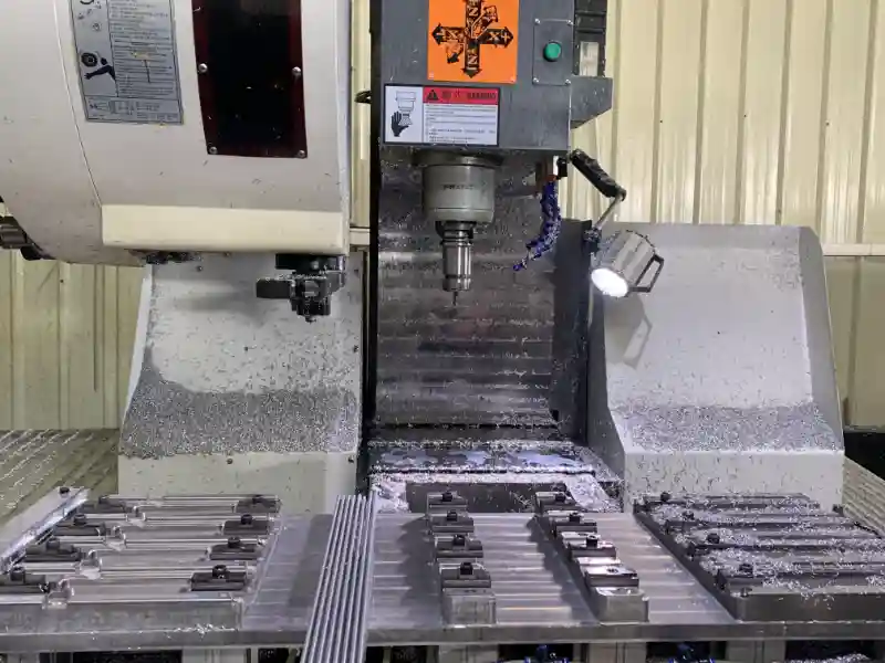 shenghai-aluminum-precision-vertical-cnc-machining-heavy-duty-fabrication Precision vertical CNC machining center at Shenghai Aluminum factory, deep processing complex industrial aluminum components with massive chip removal.